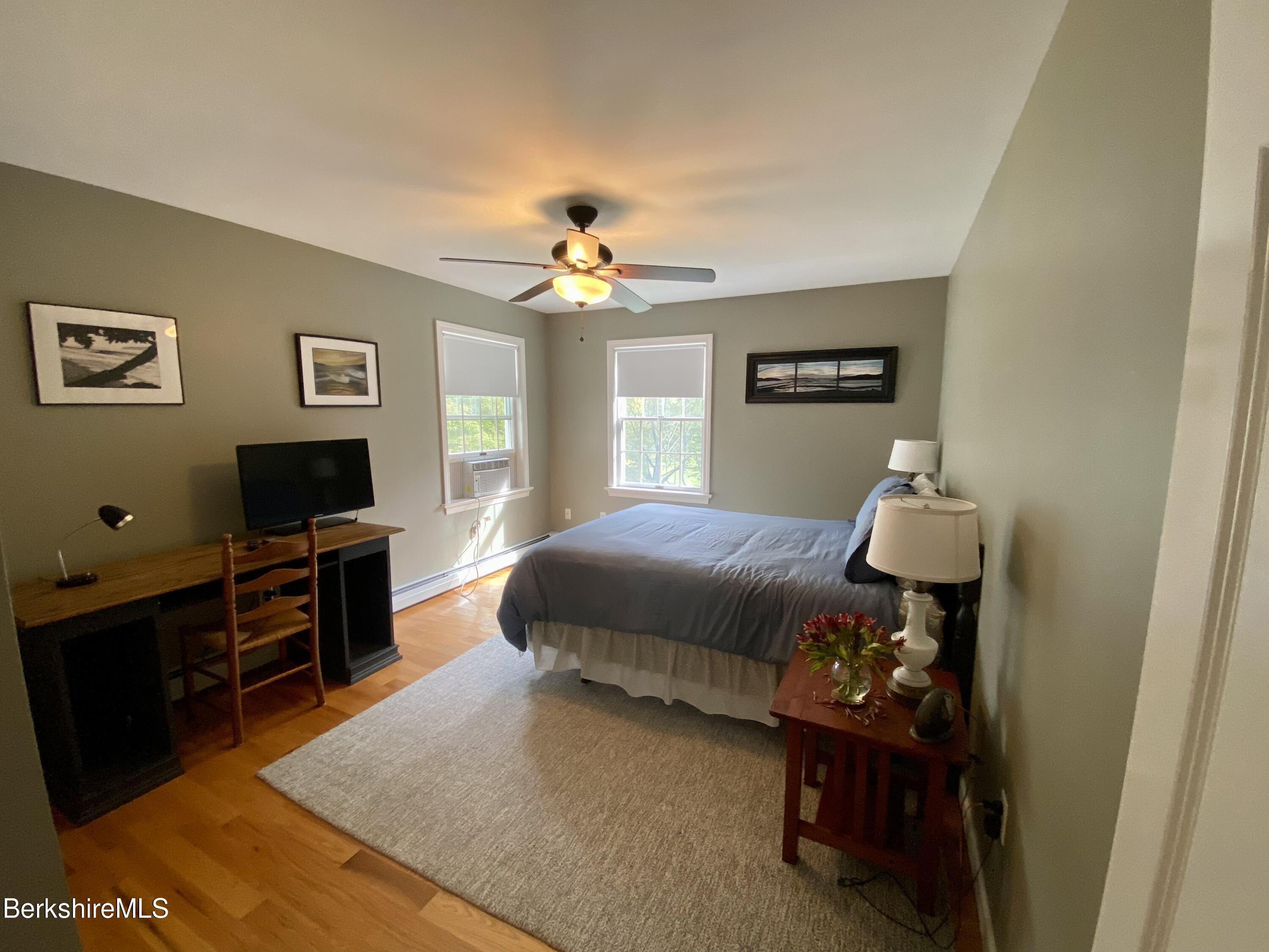 199 Old Post Road Richmond, MA 01201 - Photo 29 of 40 a bedroom with a bed and a television