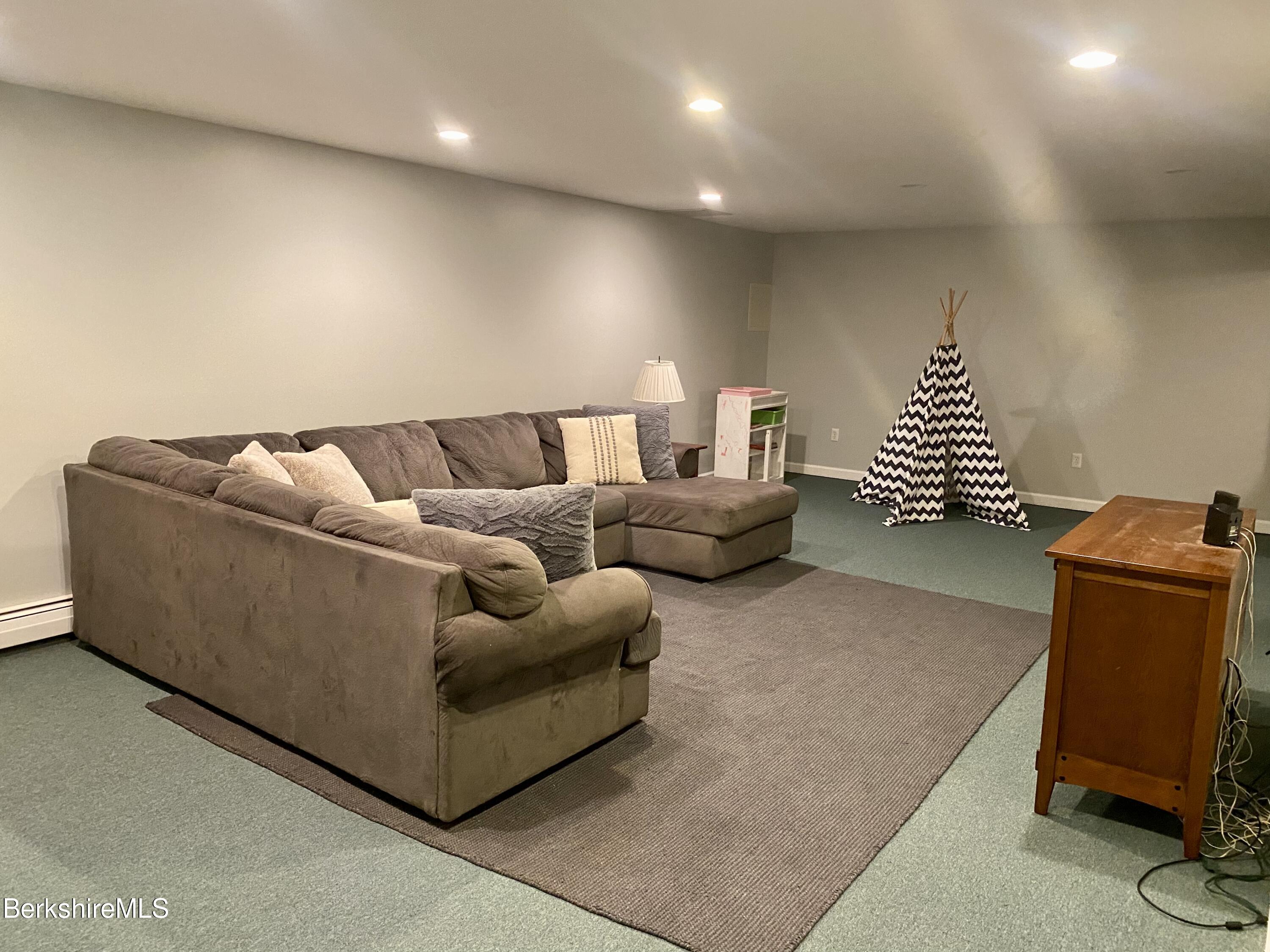 199 Old Post Road Richmond, MA 01201 - Photo 34 of 40 a living room with furniture and a couch