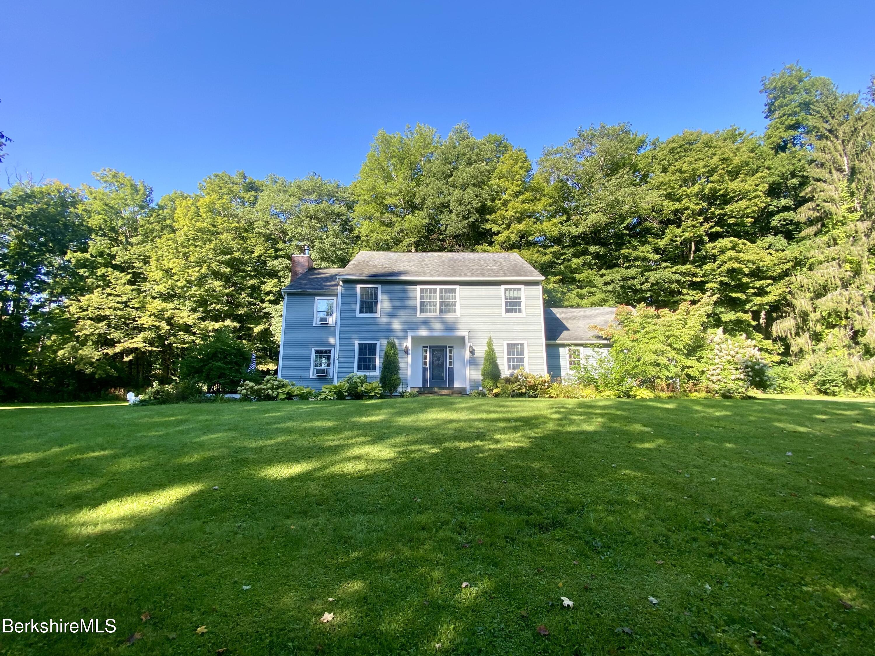 199 Old Post Road Richmond, MA 01201 - Photo 40 of 40 a front view of a house with a garden