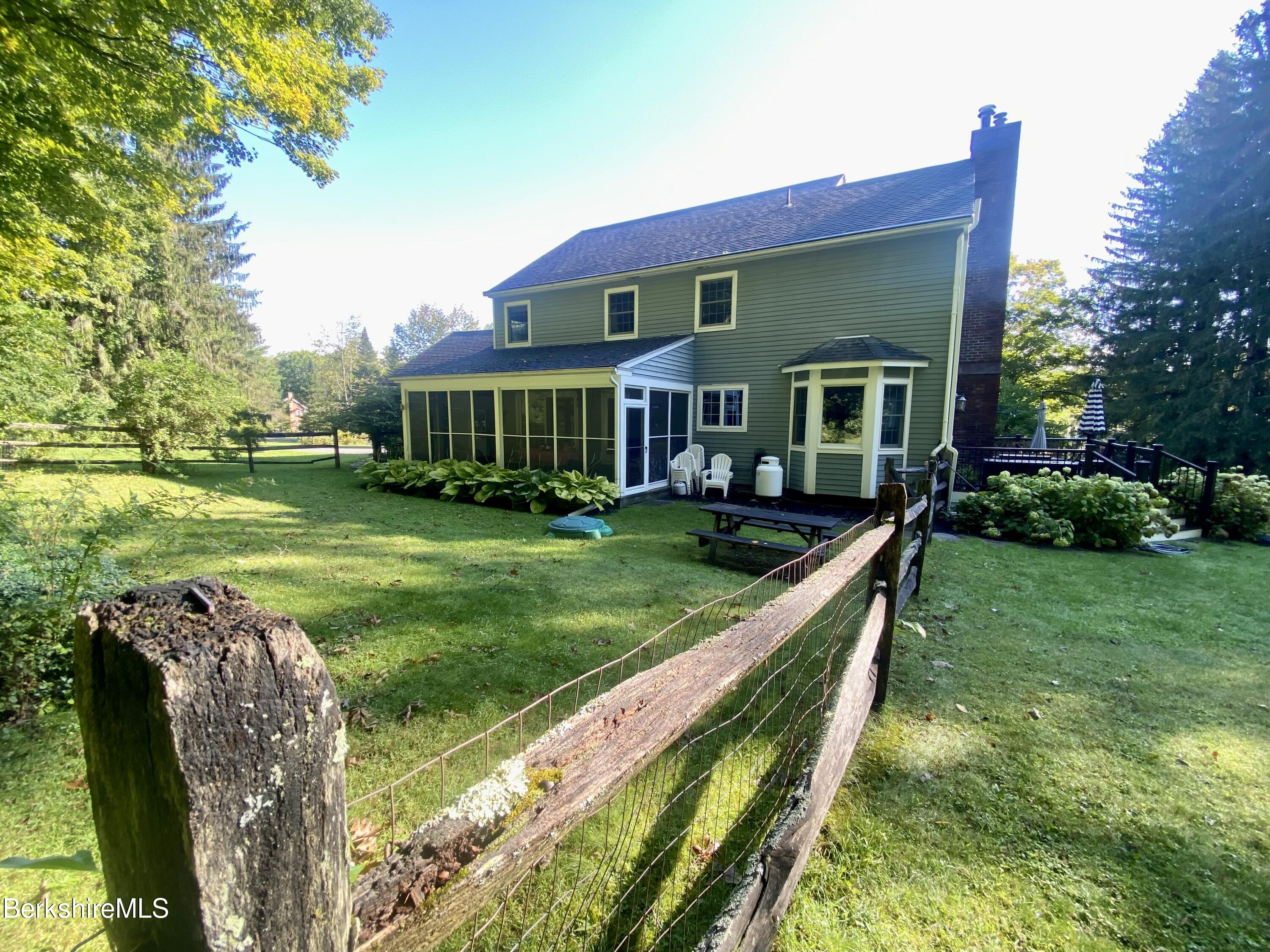 199 Old Post Road Richmond, MA 01201 - Photo 4 of 40 a front view of house with yard and green space