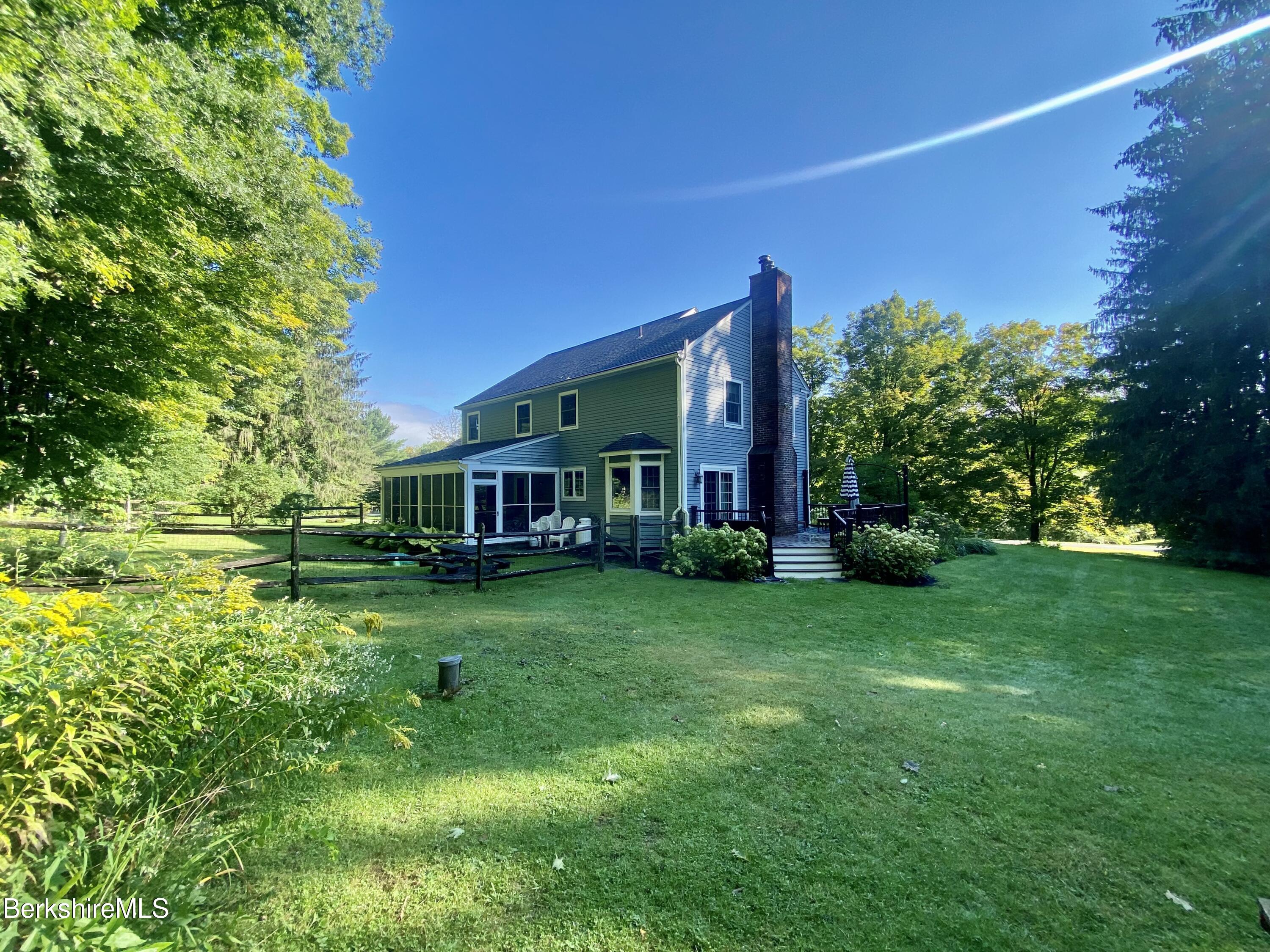 199 Old Post Road Richmond, MA 01201 - Photo 6 of 40 a view of a house with a big yard potted plants and large tree