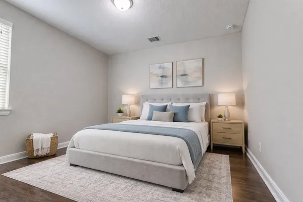 a bed room with a bed and a window