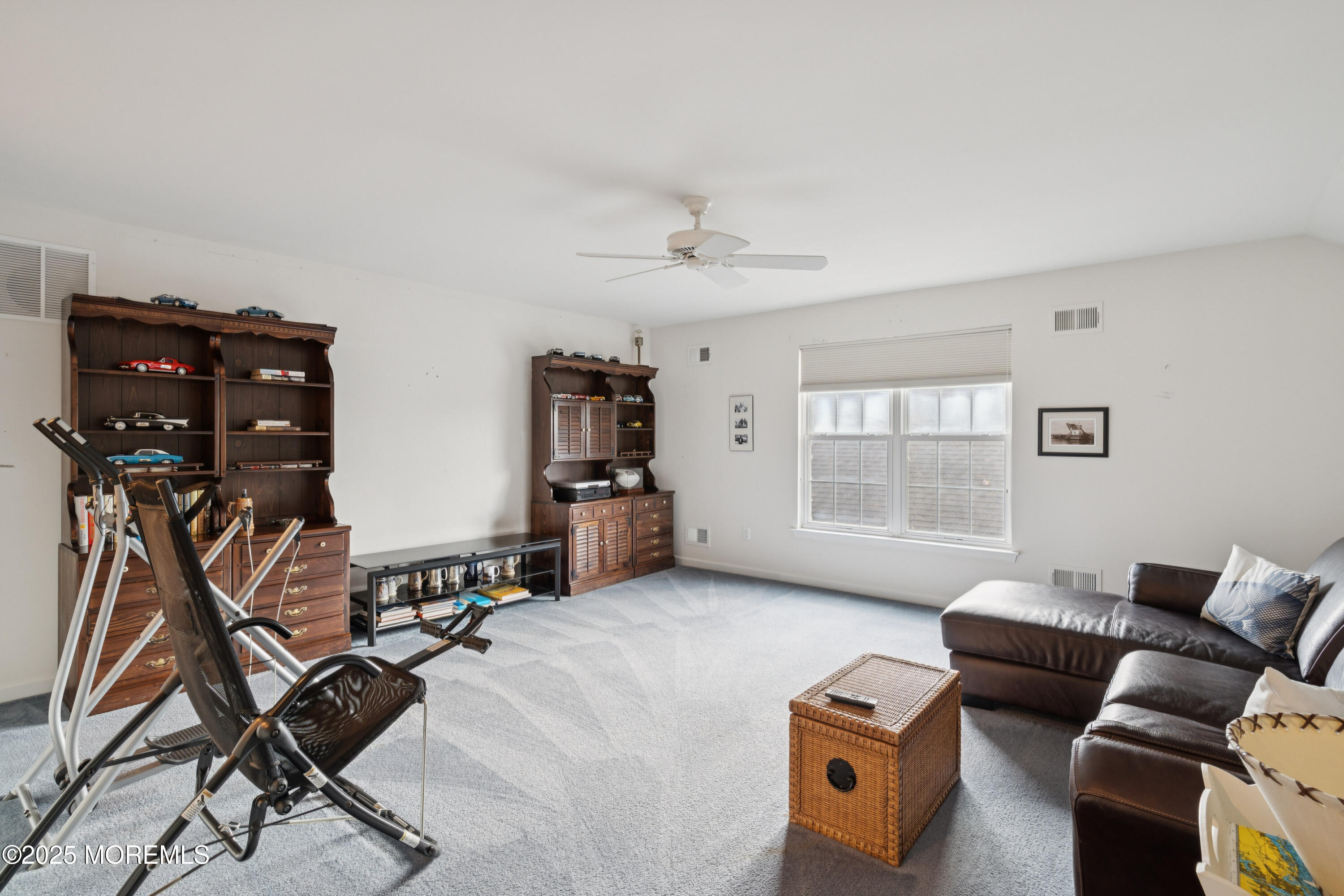 66 Crooked Stick Road Jackson, NJ 08527 - Photo 20 of 25 a livingroom with furniture and a flat screen computer