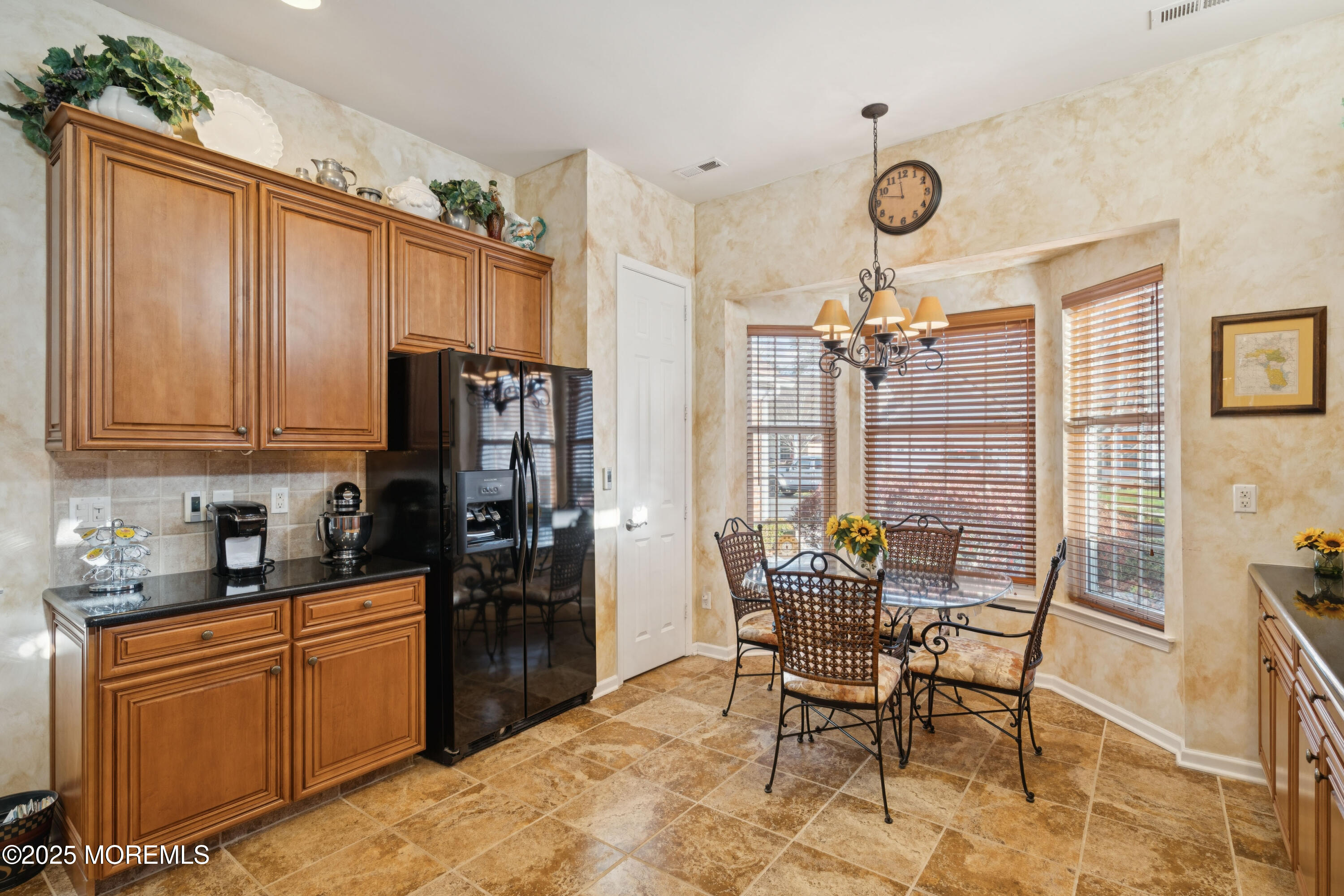 66 Crooked Stick Road Jackson, NJ 08527 - Photo 5 of 25 a kitchen with stainless steel appliances granite countertop furniture a refrigerator and dining table