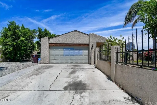 a front view of a house with a garage