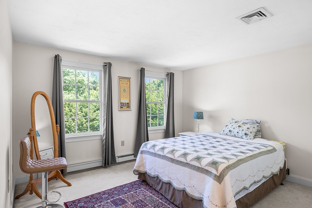 898 Main Street West Wareham, MA 02576 - Photo 22 of 36 a bedroom with a bed and a window