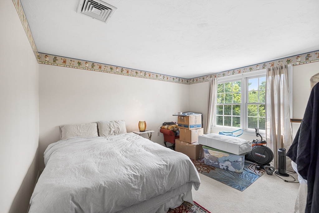 898 Main Street West Wareham, MA 02576 - Photo 24 of 36 a bedroom with a bed and a window