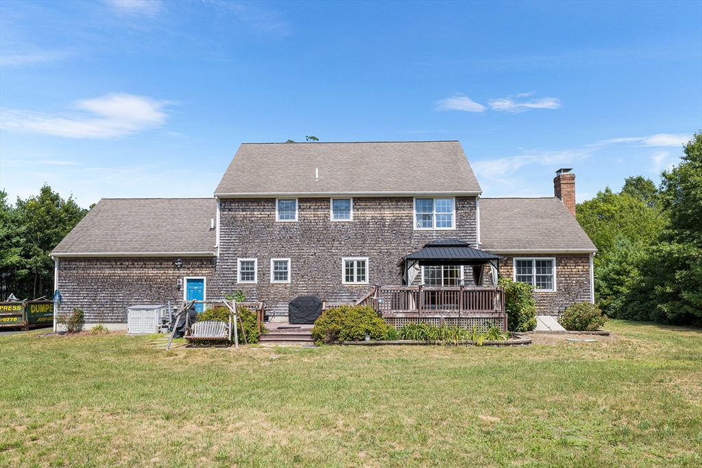 898 Main Street West Wareham, MA 02576 - Photo 35 of 36 a front view of a house with a garden and plants