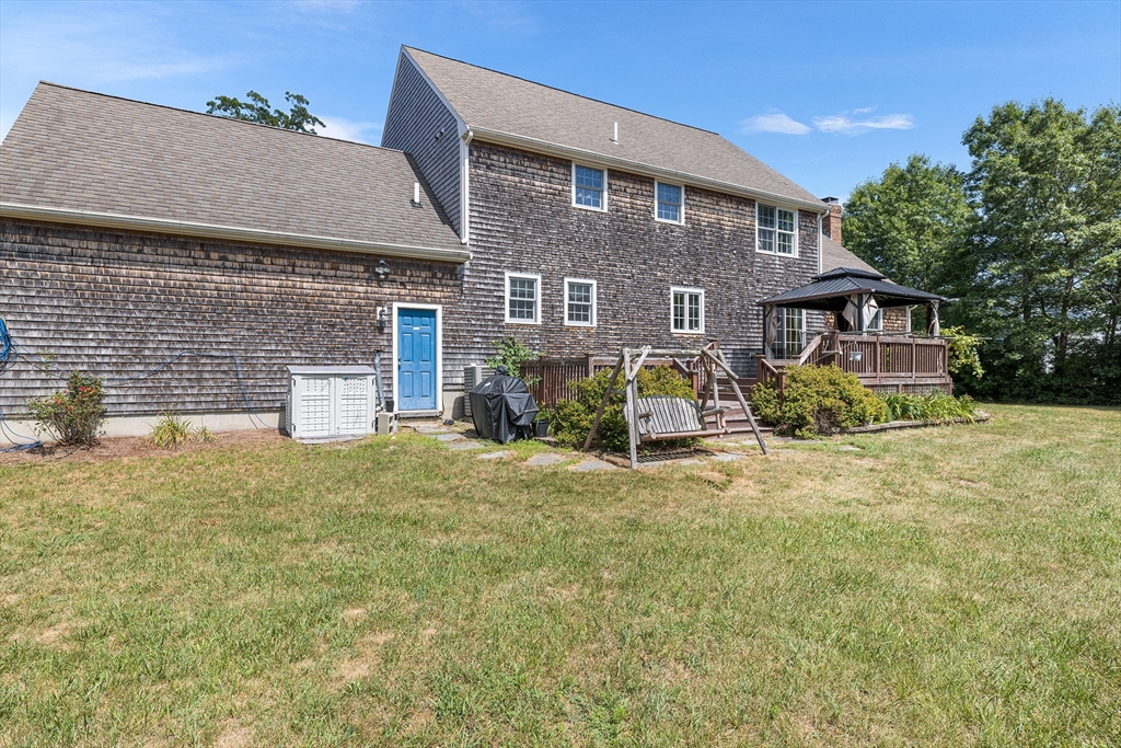 898 Main Street West Wareham, MA 02576 - Photo 36 of 36 a front view of house with yard and trees in the background