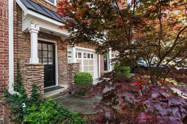 a kitchen with stainless steel appliances granite countertop a sink and a stove top oven