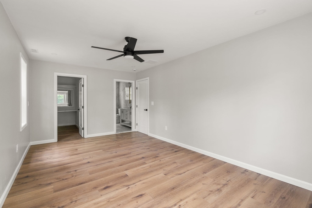 75 Hiland Road Charlton, MA 01507 - Photo 17 of 38 a view of empty room with wooden floor and ceiling fan