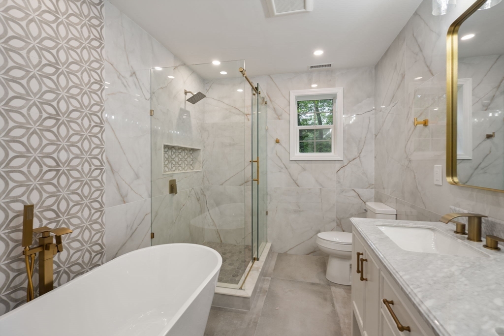 75 Hiland Road Charlton, MA 01507 - Photo 19 of 38 a bathroom with a granite countertop sink toilet and shower