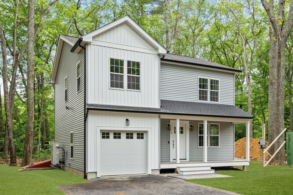 75 Hiland Road Charlton, MA 01507 - Photo 2 of 38 a view of a house with a yard and large tree