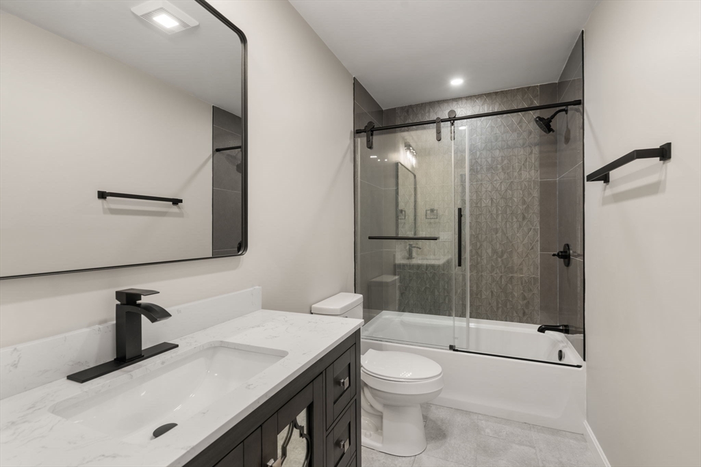 75 Hiland Road Charlton, MA 01507 - Photo 21 of 38 a bathroom with a sink a toilet and shower