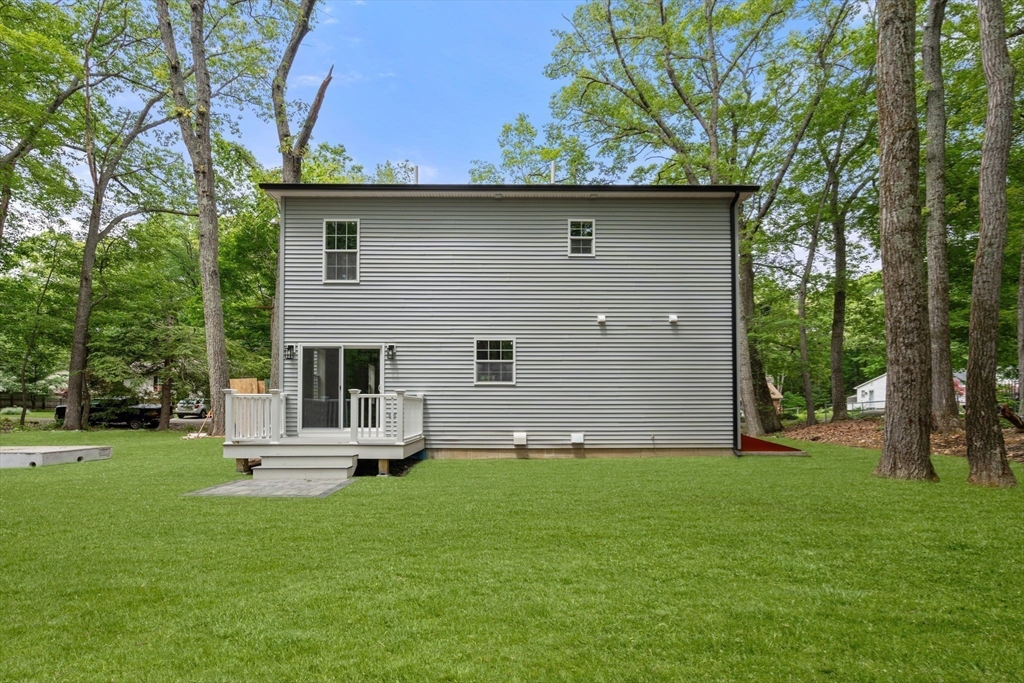 75 Hiland Road Charlton, MA 01507 - Photo 26 of 38 a front view of a house with a garden