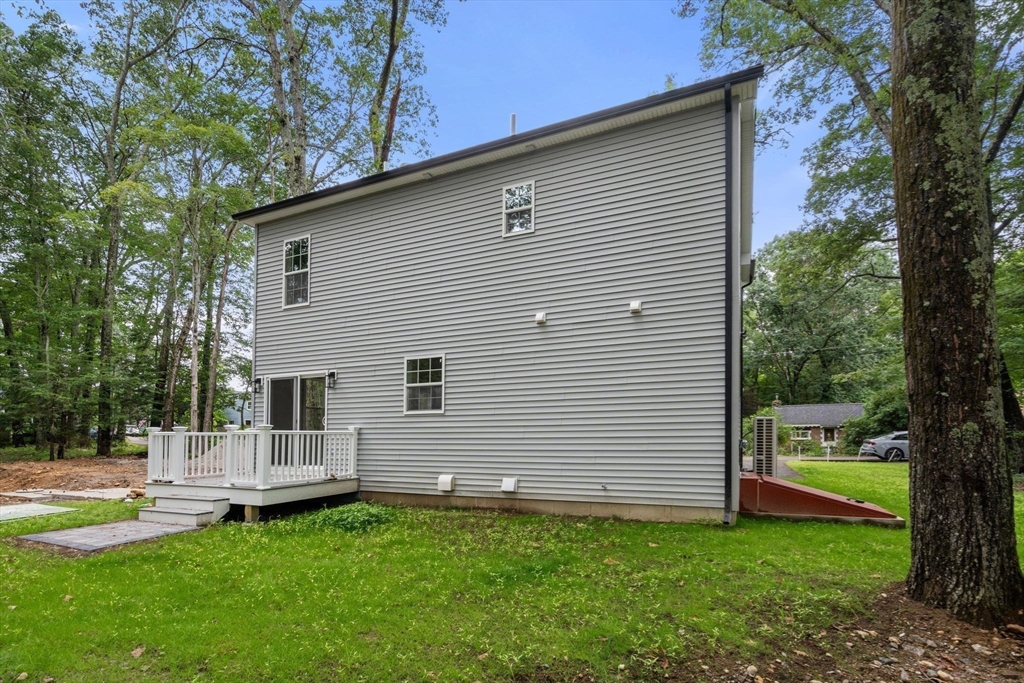 75 Hiland Road Charlton, MA 01507 - Photo 29 of 38 a view of a house with a backyard