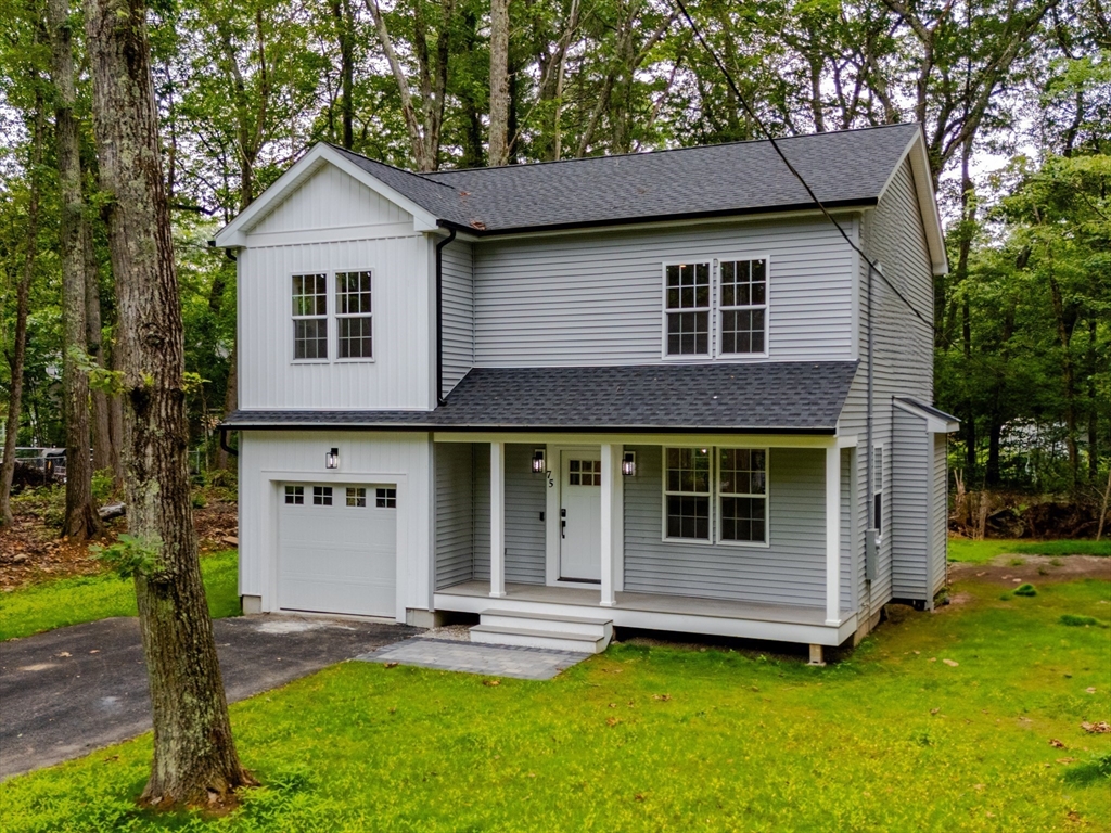 75 Hiland Road Charlton, MA 01507 - Photo 30 of 38 a view of a house with a yard and large tree