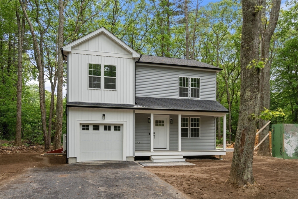 75 Hiland Road Charlton, MA 01507 - Photo 37 of 38 a front view of a house with a tree