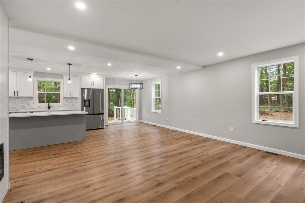 75 Hiland Road Charlton, MA 01507 - Photo 7 of 38 a view of kitchen with kitchen island wooden floor center island and stainless steel appliances