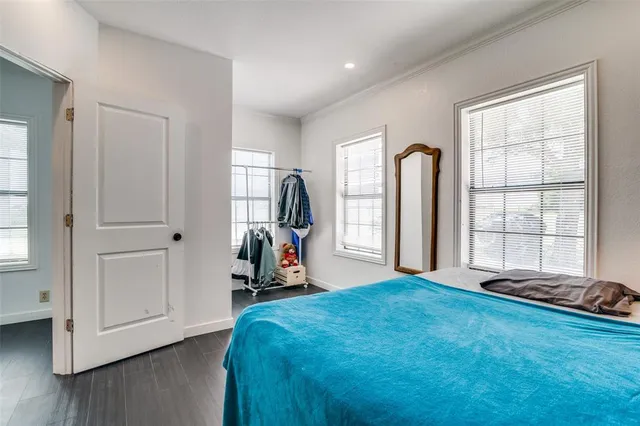 a bed room with a bed and a window