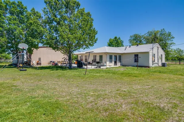 a view of a lake with a house in the background