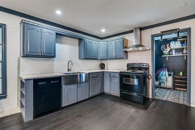 a kitchen with stainless steel appliances granite countertop a stove and a sink