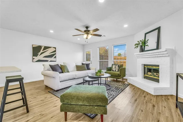 a kitchen with white cabinets and appliances
