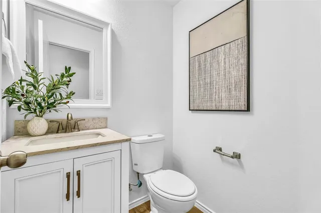 a living room with furniture kitchen view and a chandelier