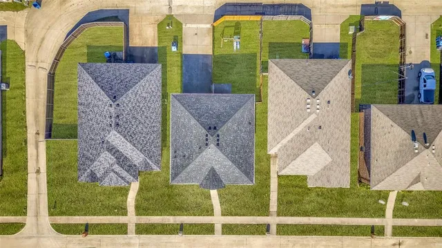 an aerial view of a house with swimming pool