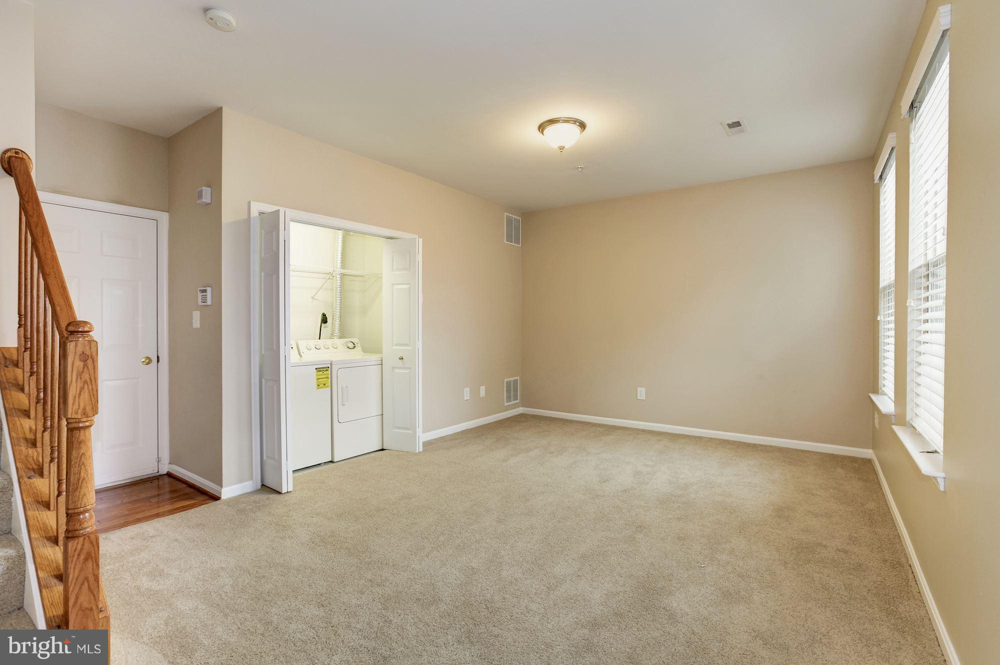 122 South Exeter Street, Unit 126 Baltimore, MD 21202 - Photo 4 of 27 Entry level laundry and entrance to garage