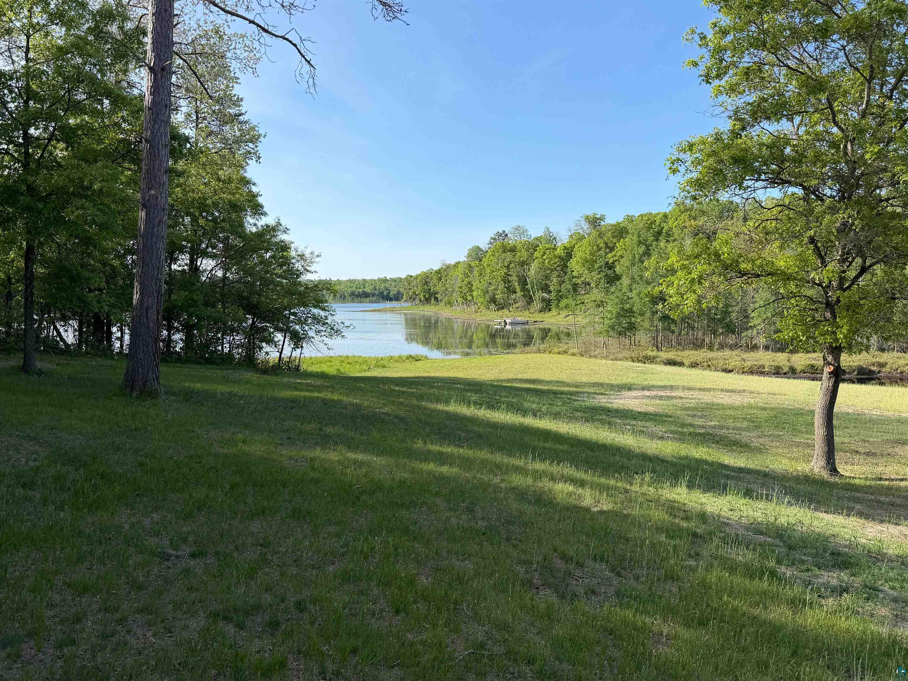 11702 East Mail Road Gordon, WI 54838 - Photo 22 of 60 Expansive green lawn with mature trees and waterfront access
