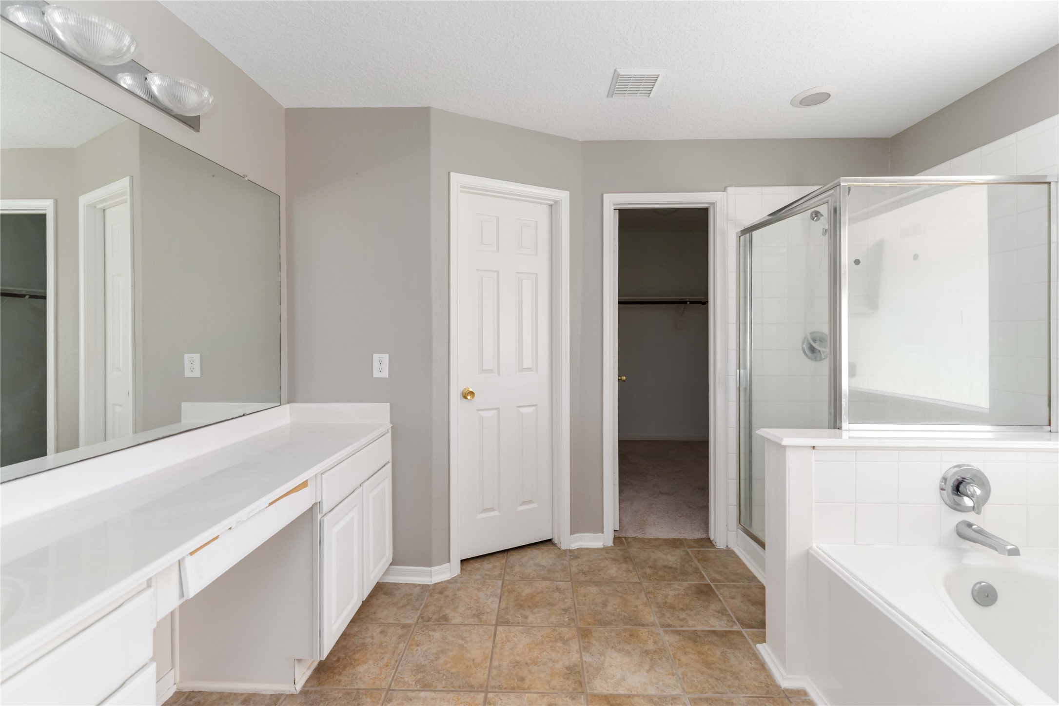 12106 Landsdown Ridge Way Humble, TX 77346 - Photo 15 of 23 a bathroom with a tub sink and mirror