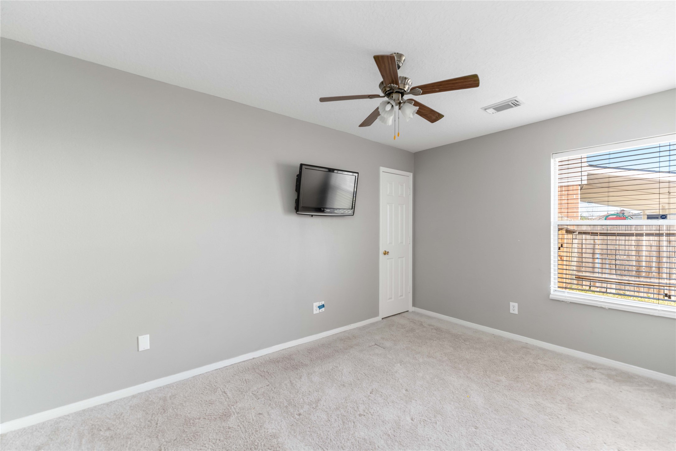 12106 Landsdown Ridge Way Humble, TX 77346 - Photo 16 of 23 a view of an empty room with a window