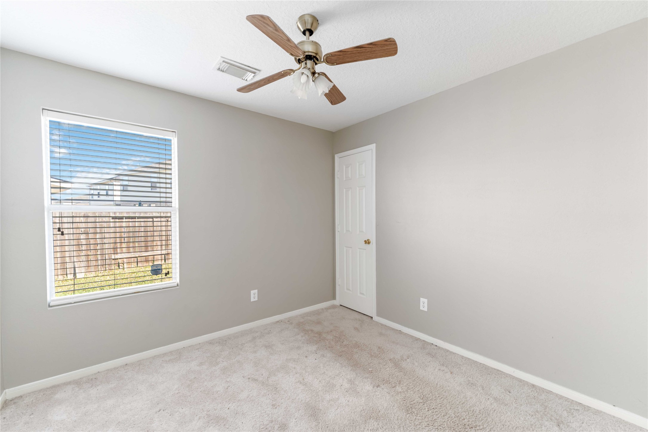 12106 Landsdown Ridge Way Humble, TX 77346 - Photo 19 of 23 a view of an empty room with a window
