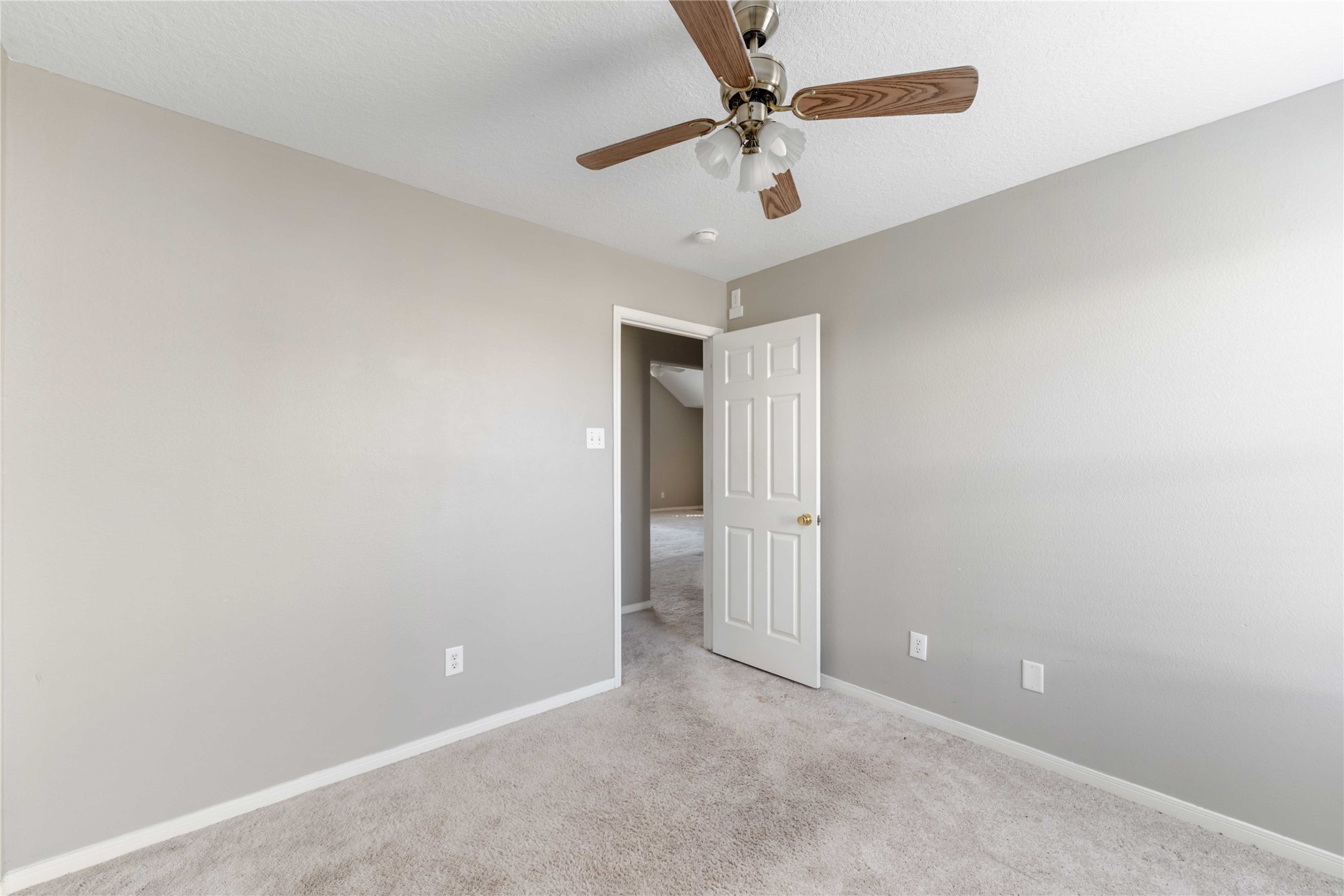 12106 Landsdown Ridge Way Humble, TX 77346 - Photo 20 of 23 en empty room with a fan and a fan