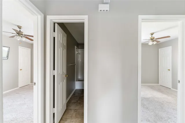 a view of a bathroom from a hallway