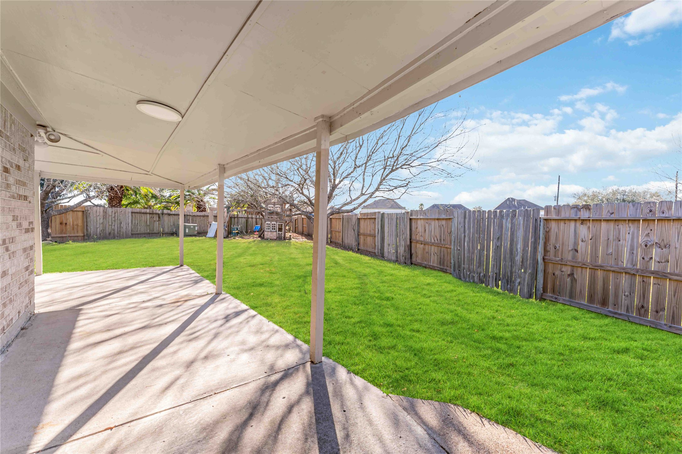 12106 Landsdown Ridge Way Humble, TX 77346 - Photo 22 of 23 a view of a backyard with wooden fence