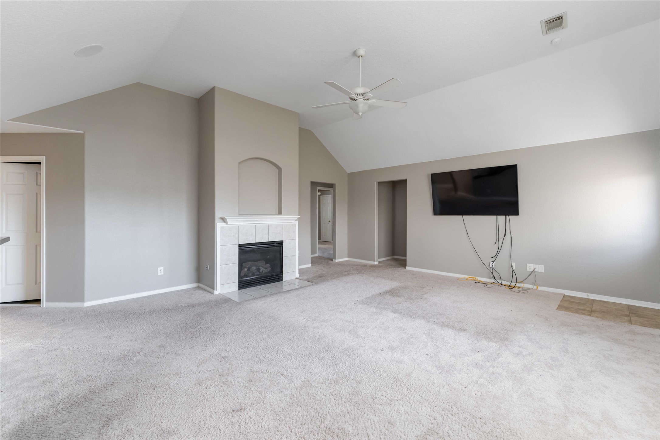 12106 Landsdown Ridge Way Humble, TX 77346 - Photo 4 of 23 a view of an empty room with a fireplace