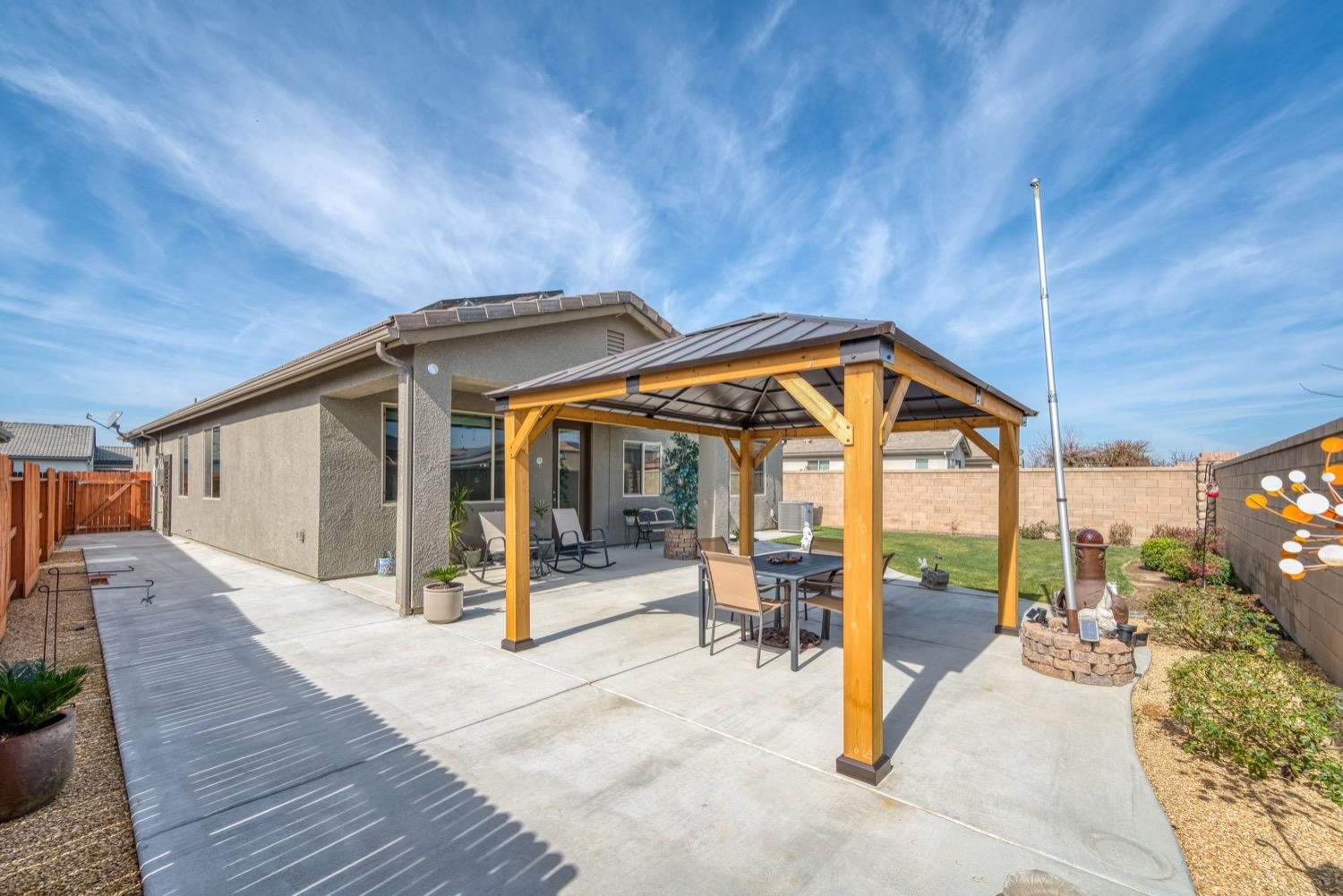 1009 Skylar Lane Clovis, CA 93619 - Photo 21 of 32 a view of a house with outdoor seating