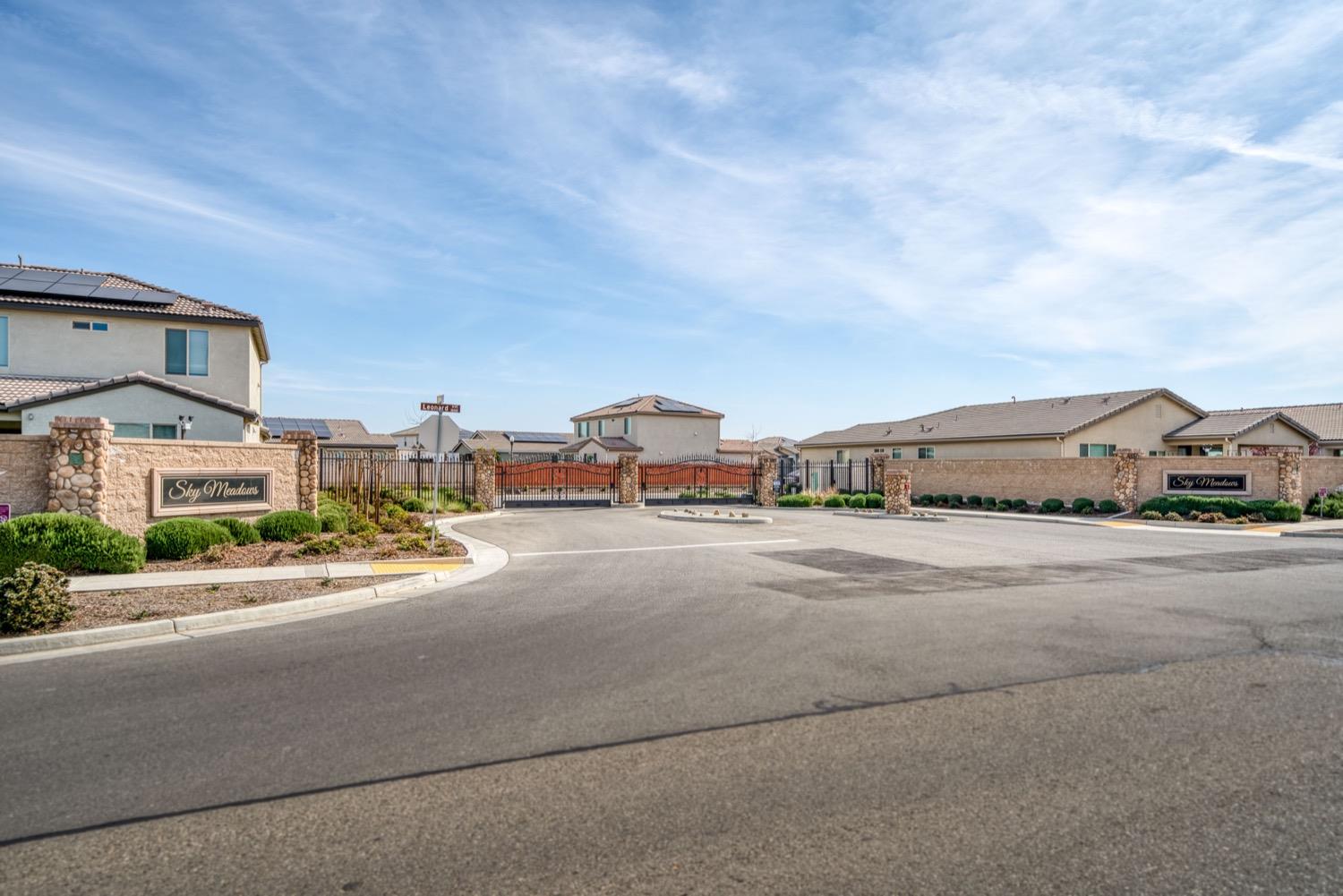 1009 Skylar Lane Clovis, CA 93619 - Photo 28 of 32 a city street with tall buildings in the background