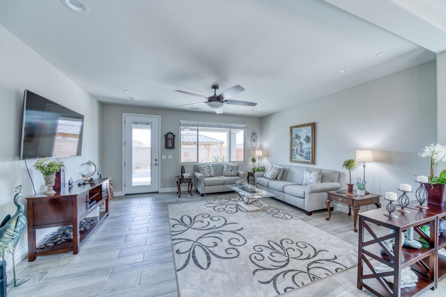 1009 Skylar Lane Clovis, CA 93619 - Photo 9 of 32 a living room with furniture and wooden floor