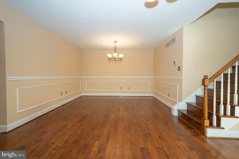 a kitchen with stainless steel appliances granite countertop a refrigerator a sink and a stove