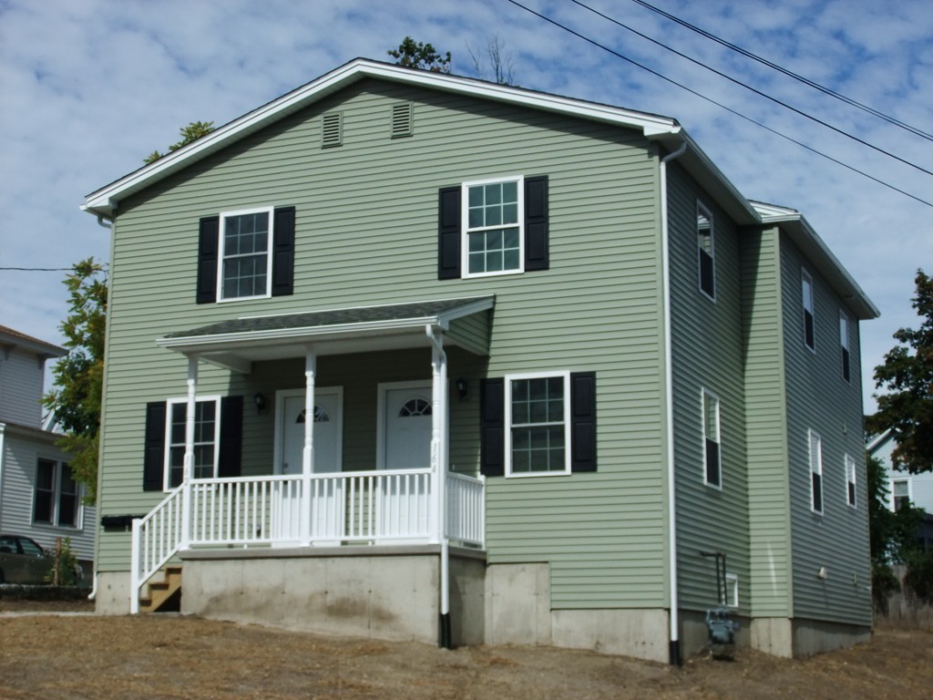 162-164 Corthell Street Springfield, MA 01151 - Photo 1 of 18 a view of a house with a yard