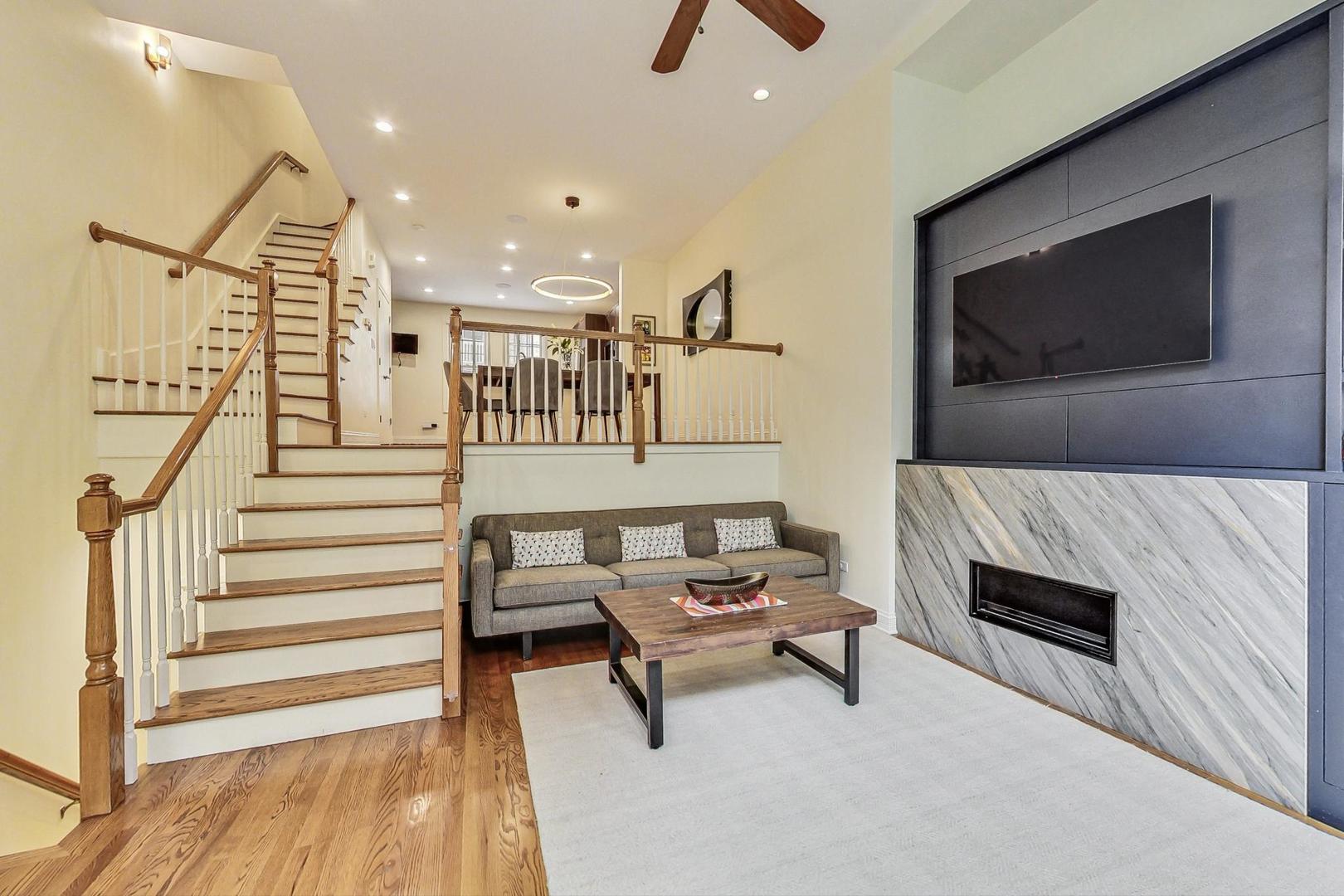 18 North Ada Street, Unit D Chicago, IL 60607 - Photo 13 of 42 a living room with furniture and a flat screen tv