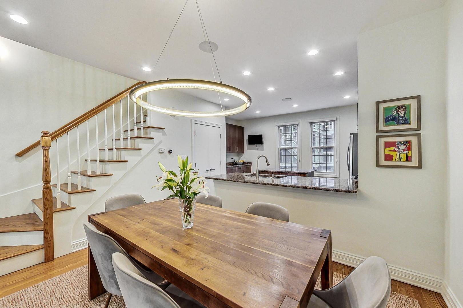 18 North Ada Street, Unit D Chicago, IL 60607 - Photo 16 of 42 a view of a dining room and hall with wooden floor