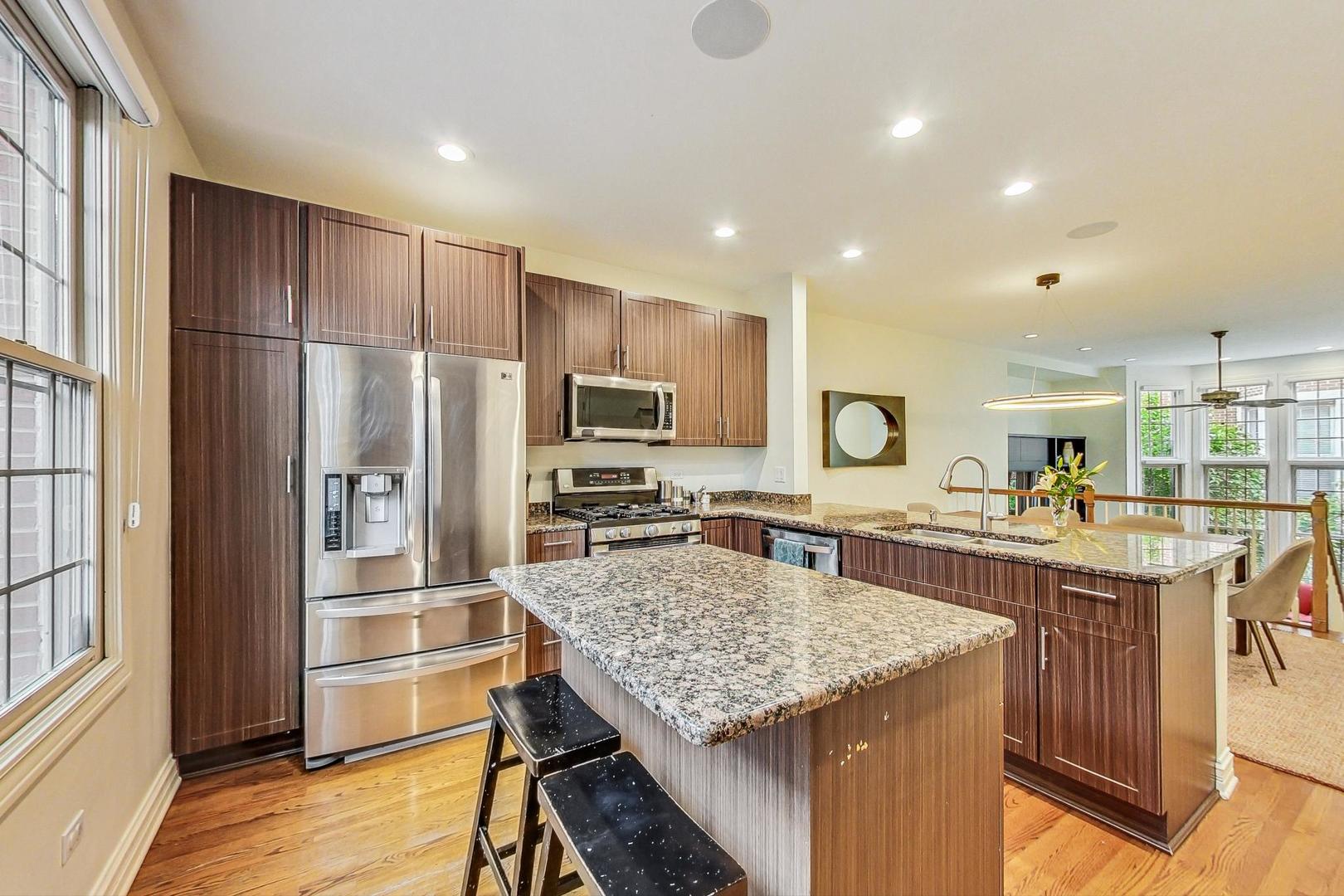 18 North Ada Street, Unit D Chicago, IL 60607 - Photo 18 of 42 a kitchen with cabinets and refrigerator