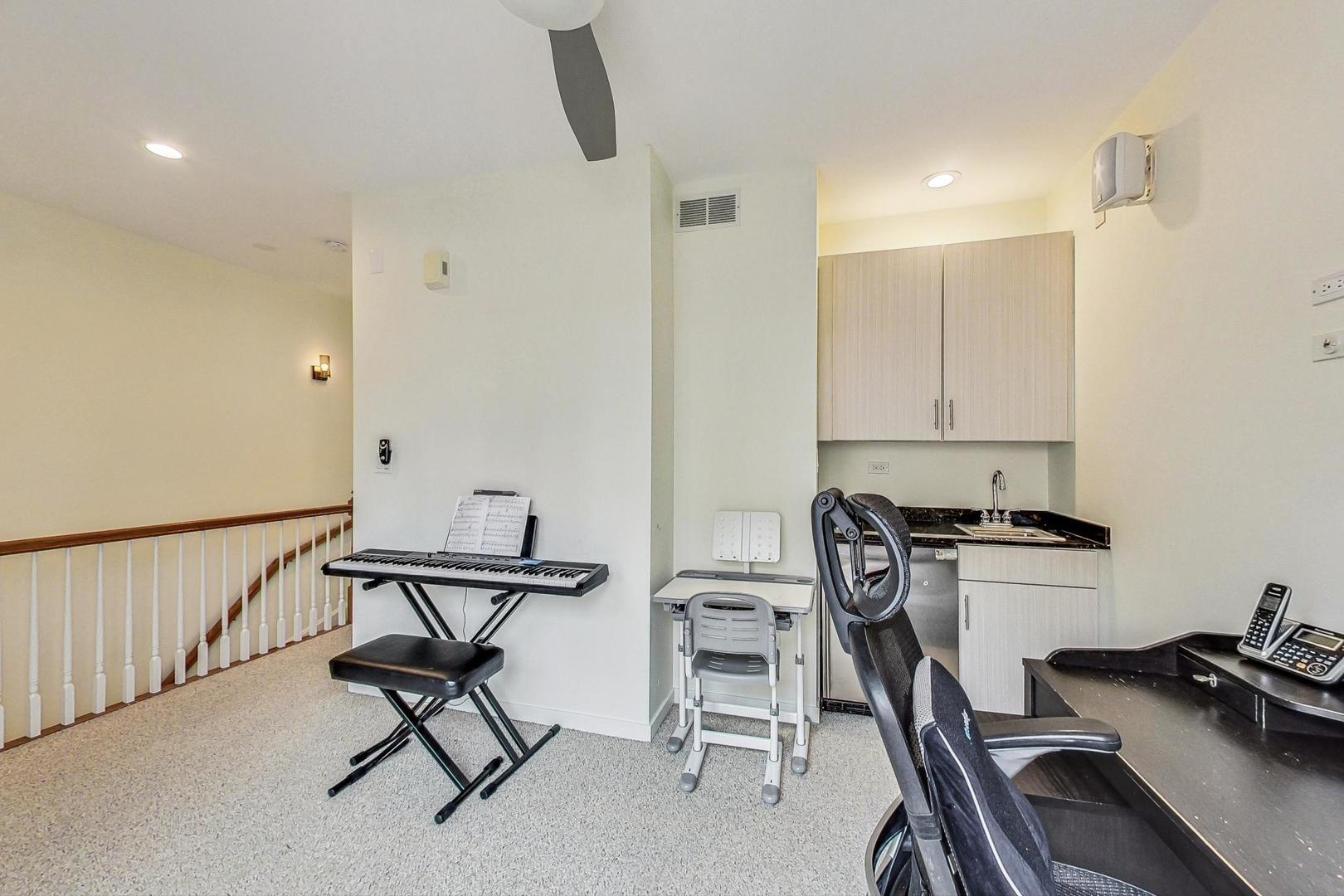 18 North Ada Street, Unit D Chicago, IL 60607 - Photo 30 of 42 a view of a workspace with furniture and a window