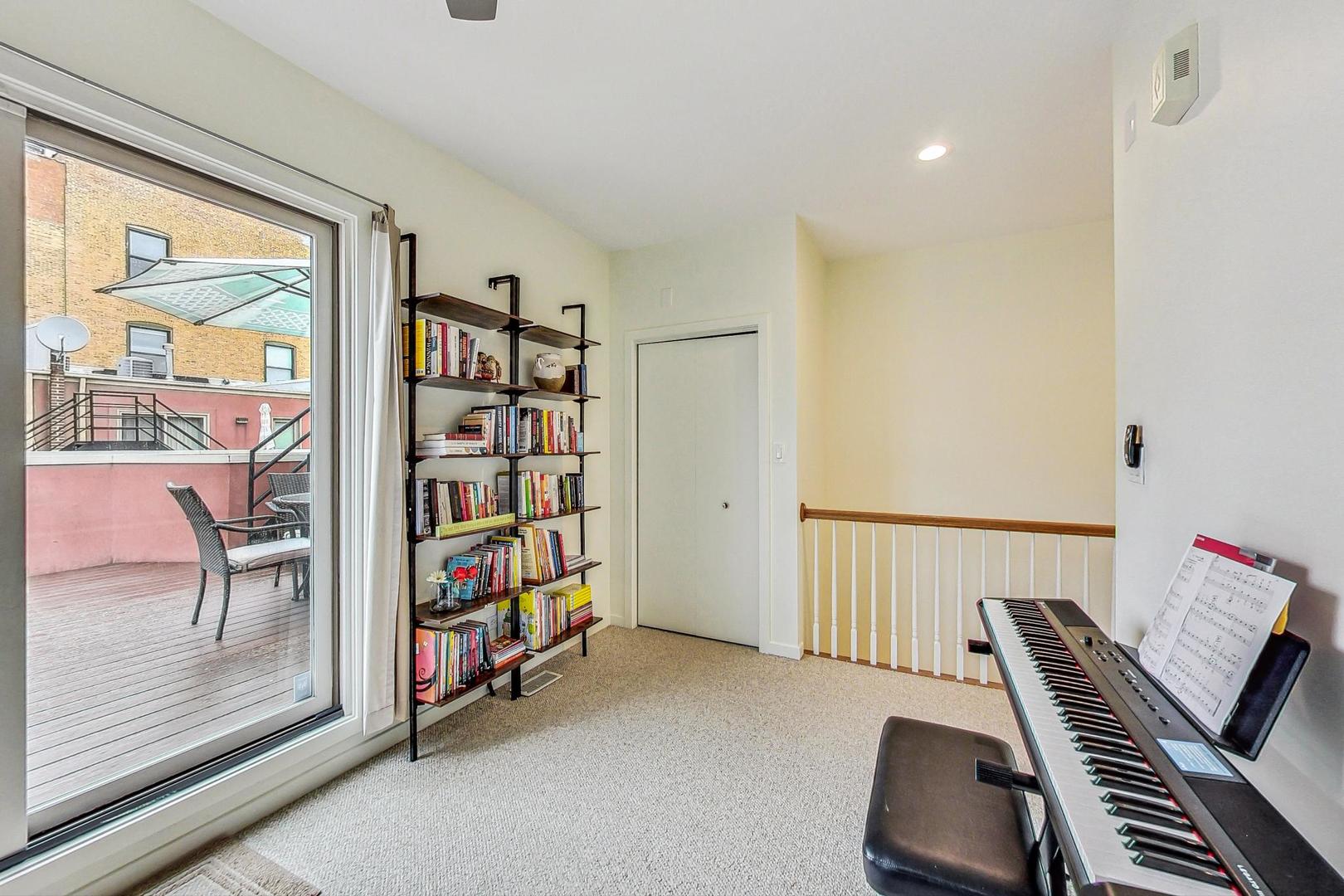 18 North Ada Street, Unit D Chicago, IL 60607 - Photo 31 of 42 a view of a livingroom with furniture and staircase