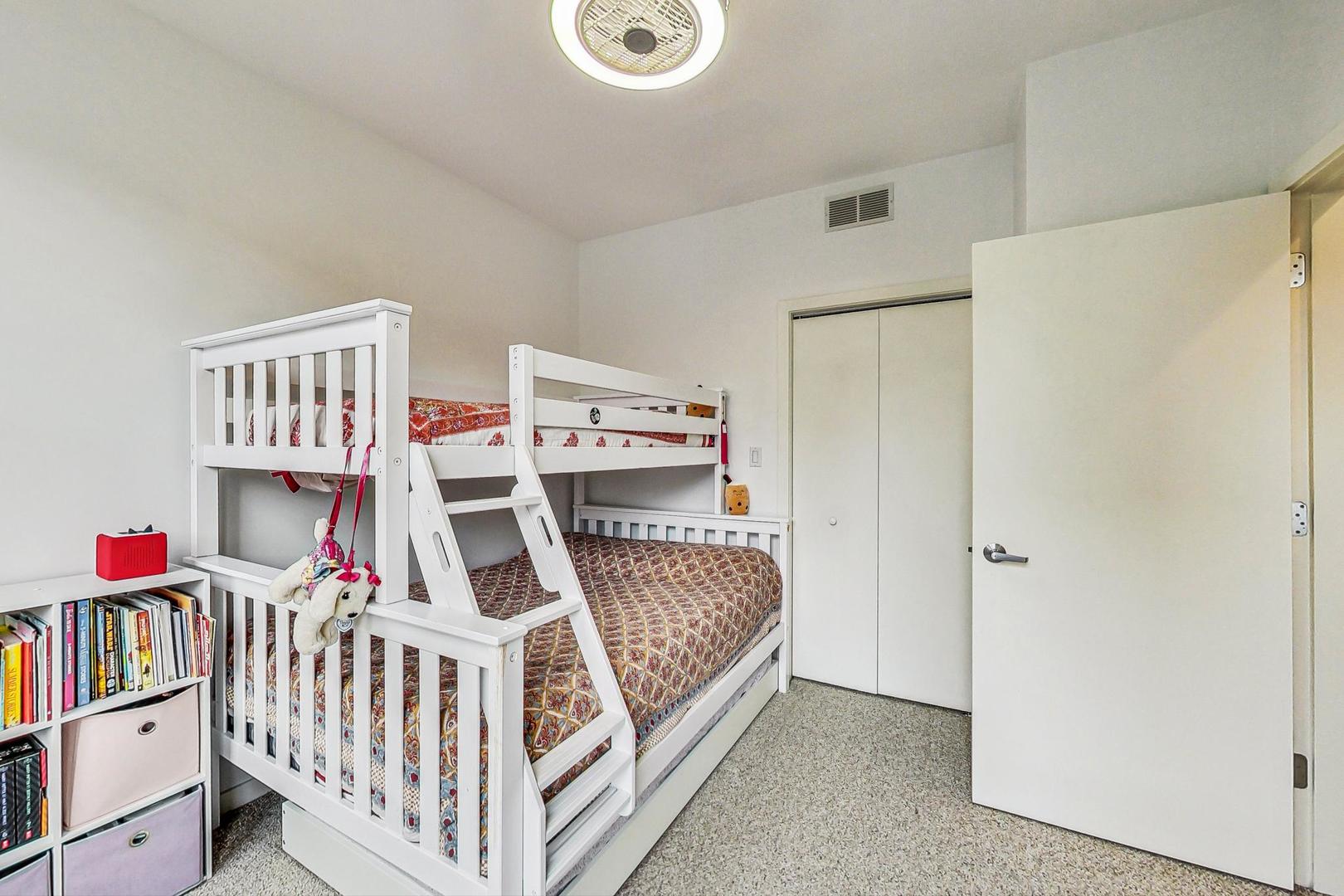 18 North Ada Street, Unit D Chicago, IL 60607 - Photo 34 of 42 a bedroom with furniture and a baby crib