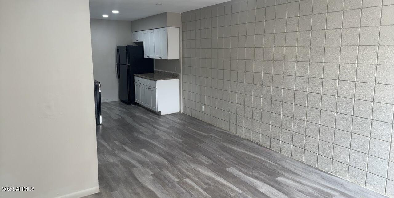 2034 West Cactus Road, Unit C Phoenix, AZ 85029 - Photo 5 of 10 a kitchen with a sink and refrigerator